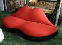 Long view of Mae West sofa damaged by Anthrenus larvae, woolly bears