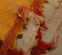 Tineola damage and frass on wool